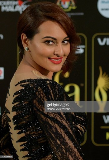 Bollywood actress Sonakshi Sinha poses on the green carpet as she arrives to attend the final day of