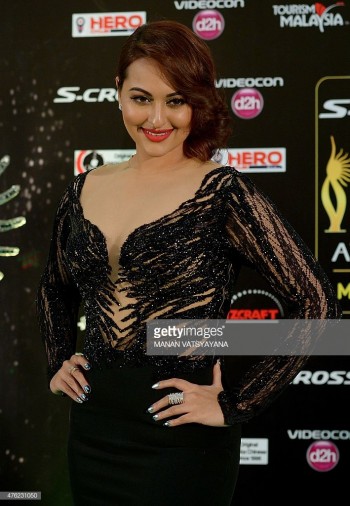 Bollywood actress Sonakshi Sinha poses on the green carpet as she arrives to attend the final day of